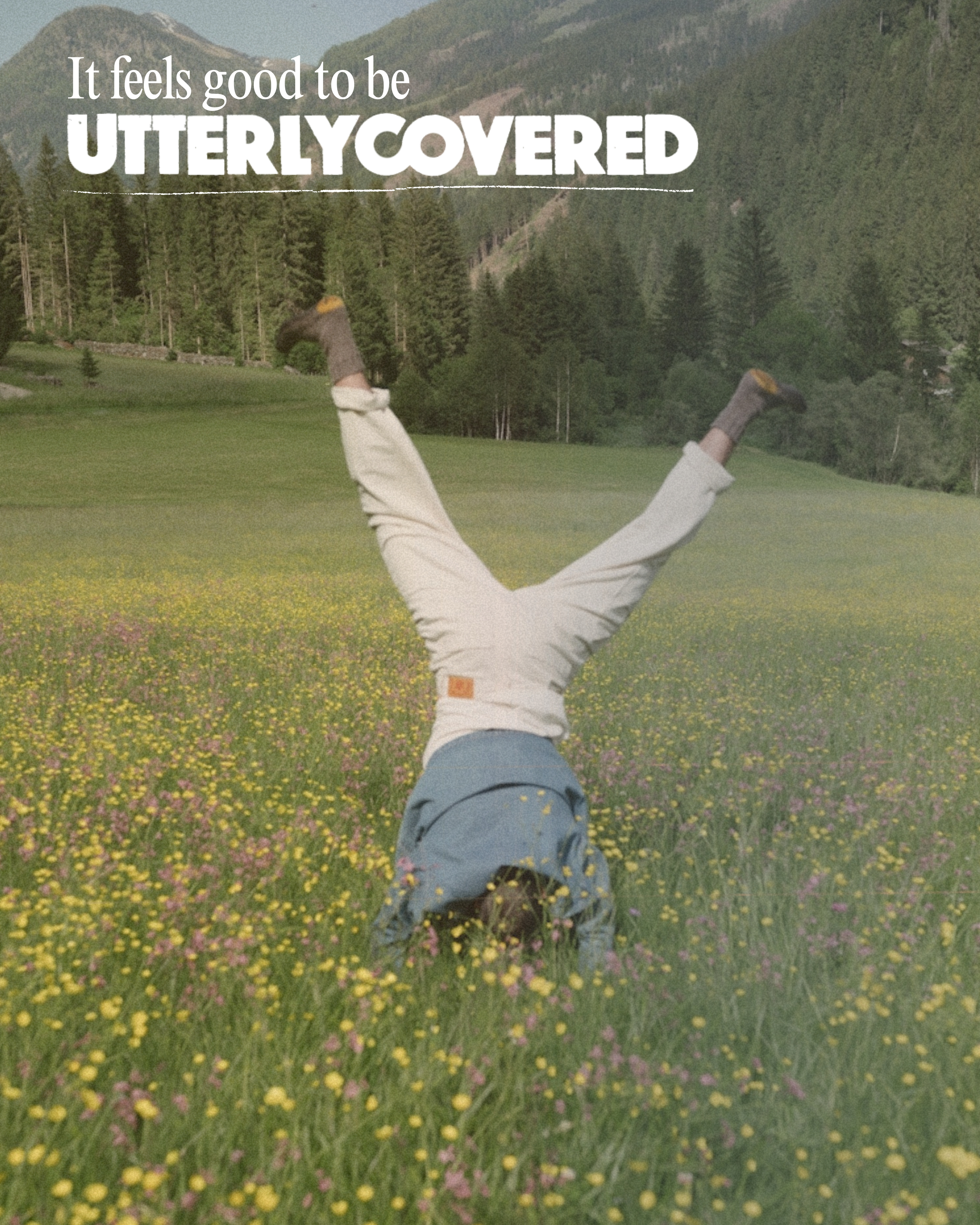 Person doing handstand in flower meadow - It feels good to be UtterlyCovered
