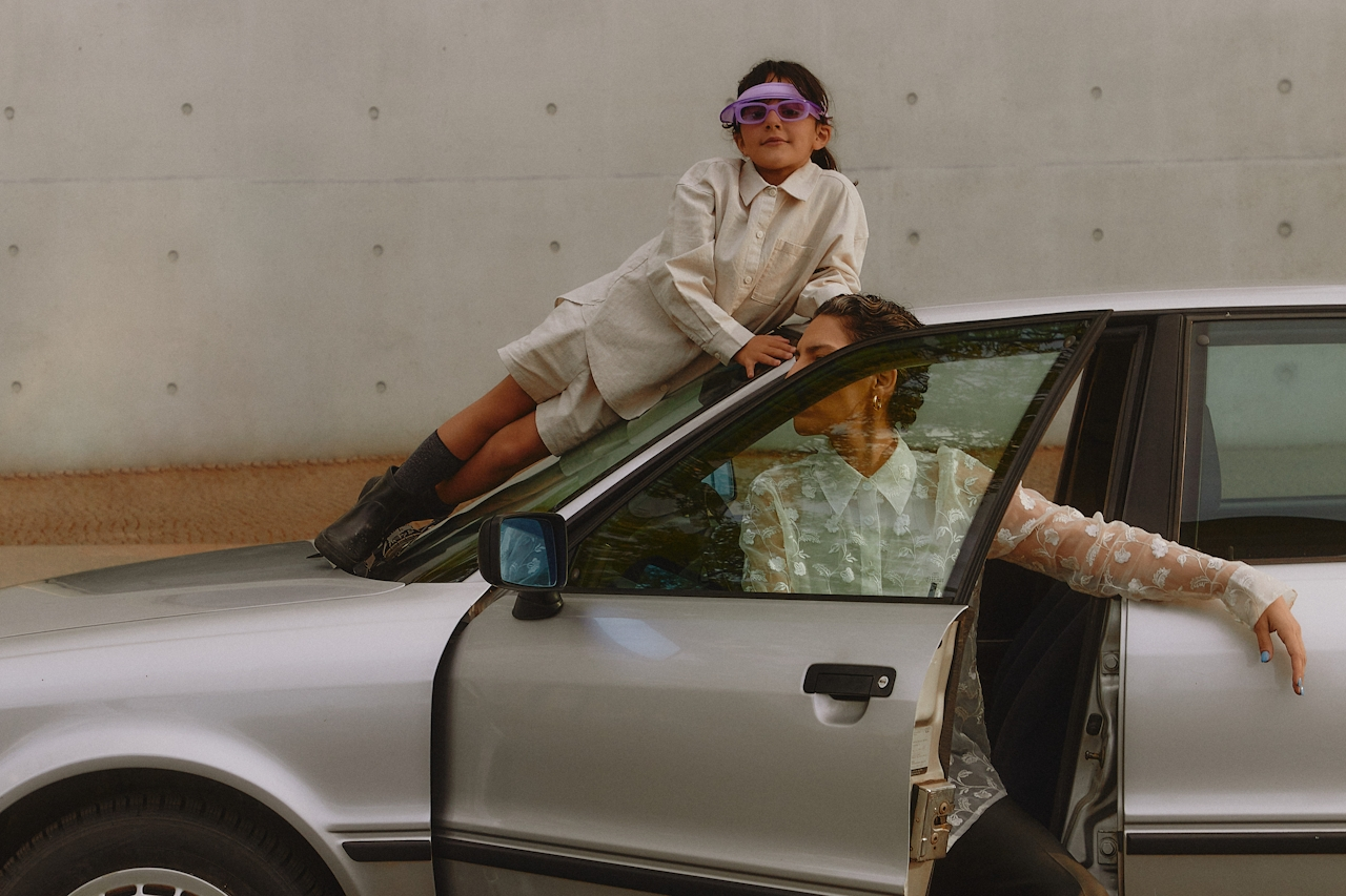 Family with car - It feels good to be protected with the right car insurance cover