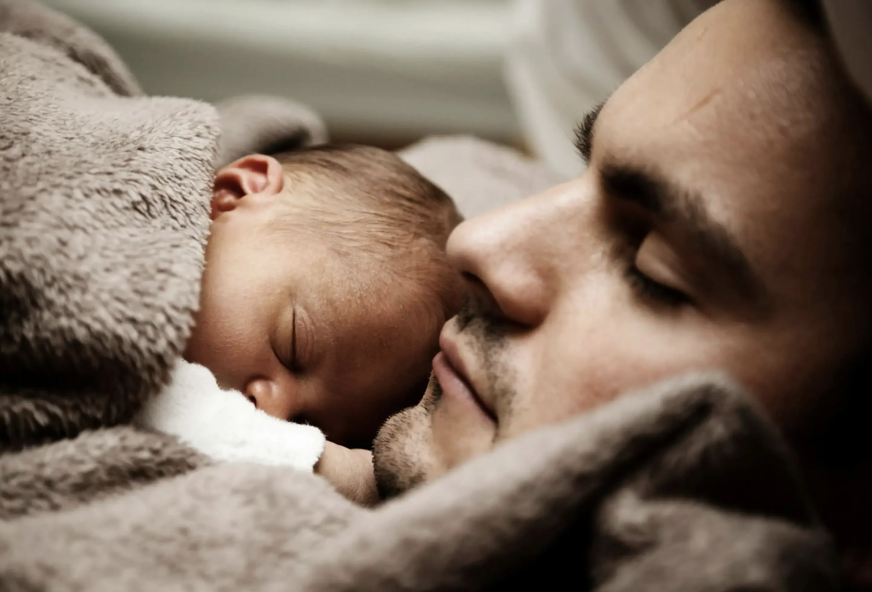 Father and baby sharing tender moment
